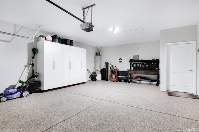 garage with secured water heater and a garage door opener