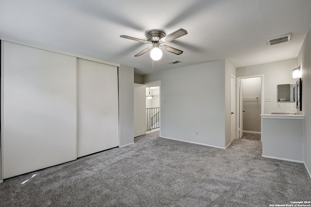 unfurnished bedroom featuring visible vents and carpet floors