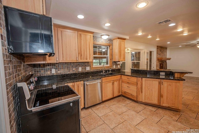 kitchen with tasteful backsplash, electric range oven, dark stone countertops, stainless steel dishwasher, and kitchen peninsula