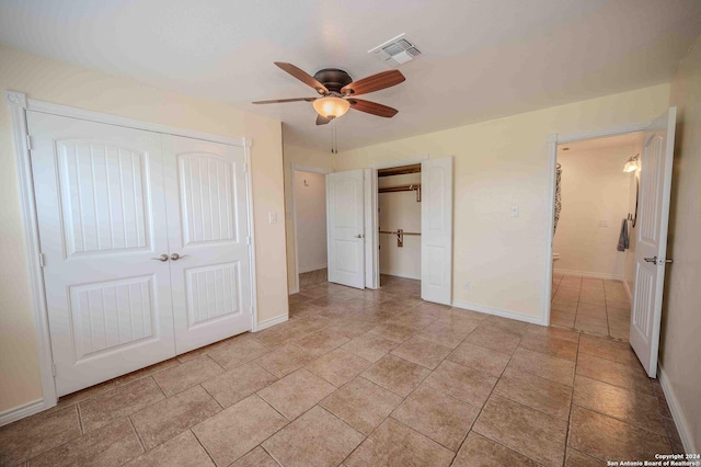 unfurnished bedroom featuring ceiling fan