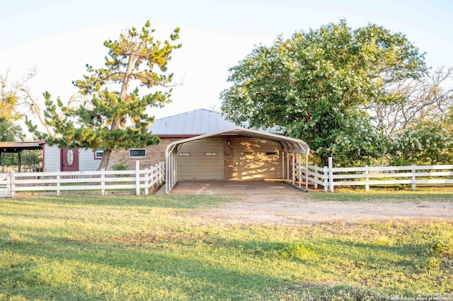 exterior space with a carport and a lawn