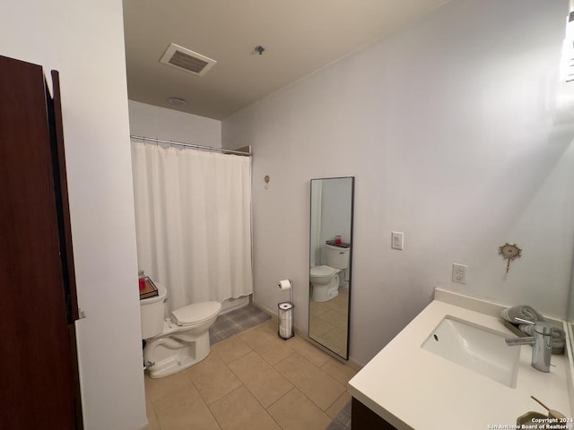 bathroom featuring tile patterned flooring, vanity, toilet, and a shower with shower curtain