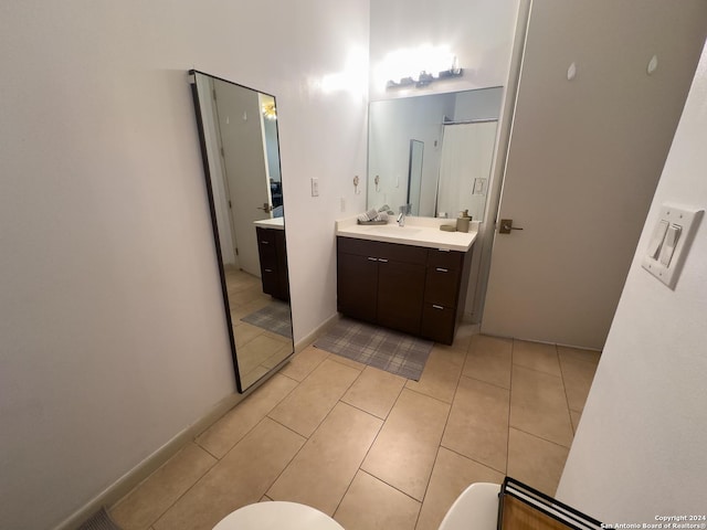 bathroom with tile patterned floors and vanity