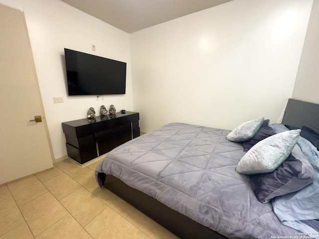 bedroom with light tile patterned flooring