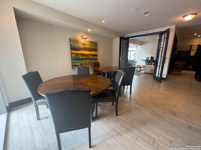 dining area with light hardwood / wood-style flooring