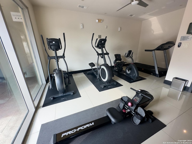 workout room featuring tile patterned floors and ceiling fan