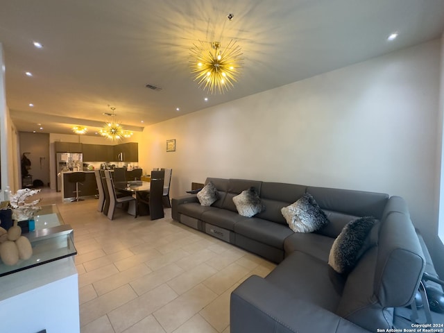 living room with a notable chandelier