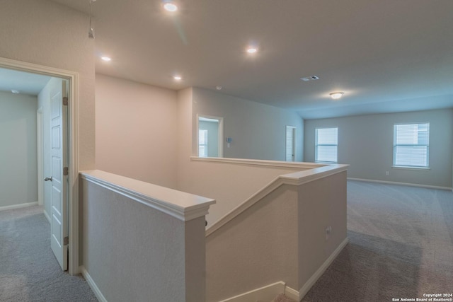 corridor featuring carpet flooring