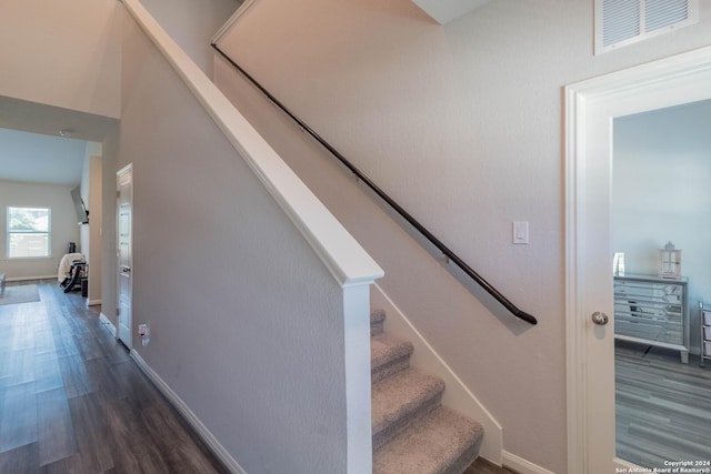 stairs with wood-type flooring