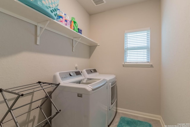 laundry area featuring independent washer and dryer