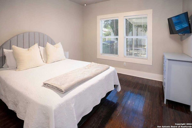 bedroom featuring dark hardwood / wood-style floors