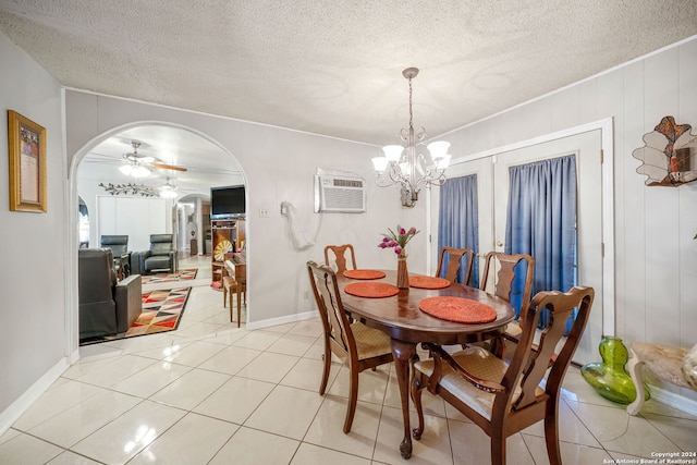 dining room featuring french doors, a wall mounted AC, a textured ceiling, light tile patterned floors, and ceiling fan with notable chandelier