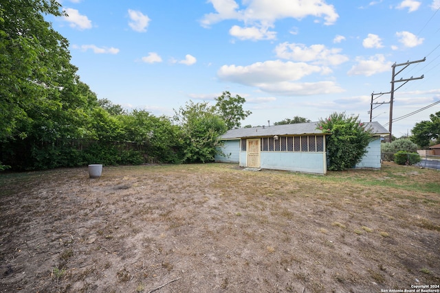 view of yard with a sunroom