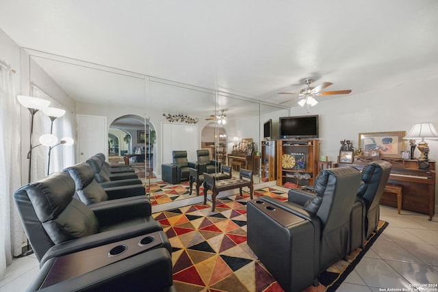 tiled living room with ceiling fan