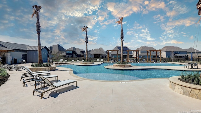 view of swimming pool with a patio area