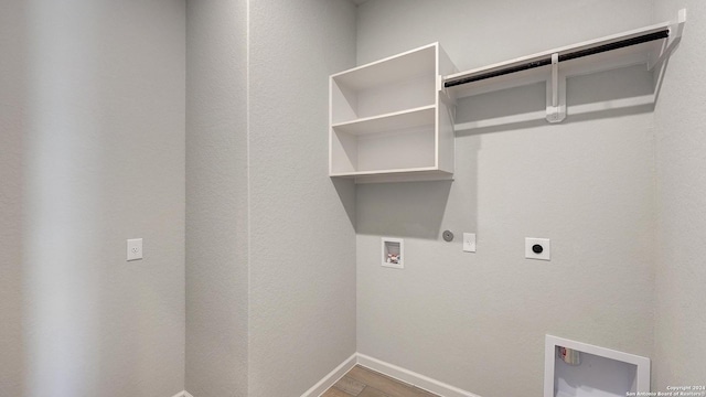 clothes washing area with hookup for an electric dryer, hardwood / wood-style floors, and washer hookup