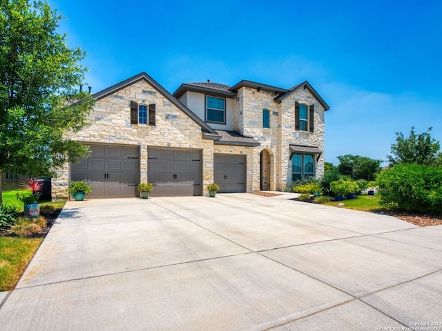 view of front of home with a garage and driveway