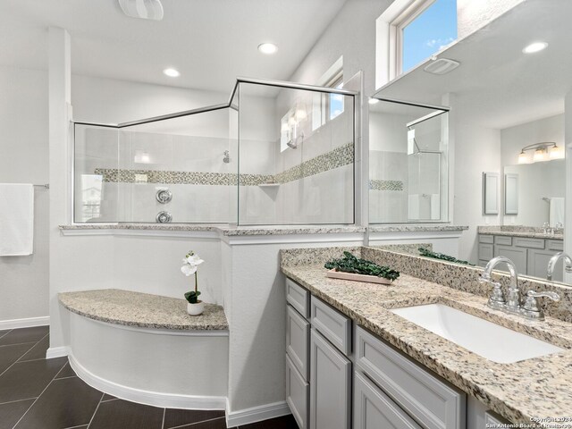 bathroom with tile flooring, an enclosed shower, and oversized vanity