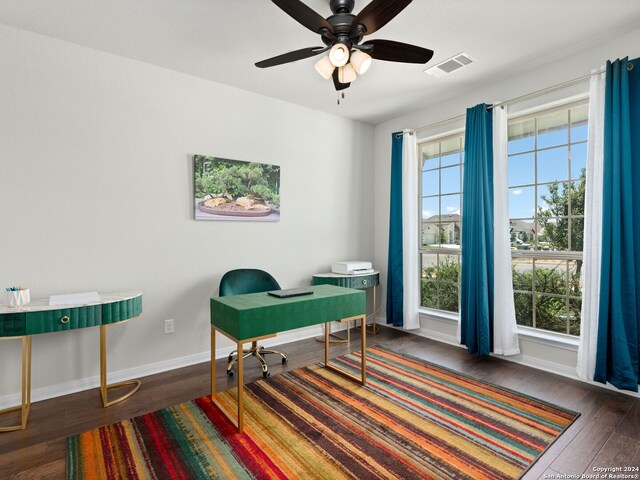 office area with dark hardwood / wood-style flooring, ceiling fan, and plenty of natural light