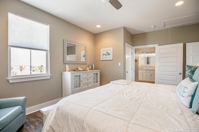 bedroom with ceiling fan, ensuite bathroom, and dark hardwood / wood-style floors