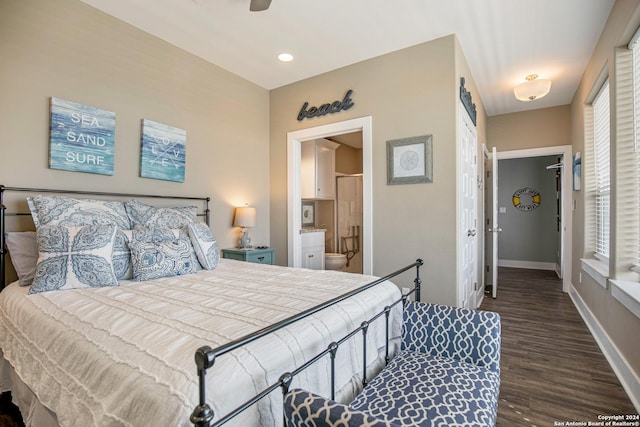 bedroom featuring dark hardwood / wood-style flooring, multiple windows, ceiling fan, and ensuite bathroom