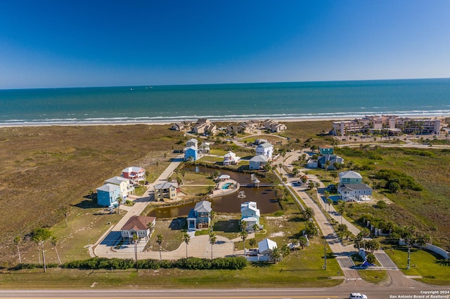 aerial view featuring a water view and a beach view