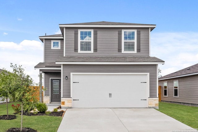 ranch-style house with a garage and a front lawn