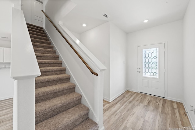 foyer with light hardwood / wood-style floors