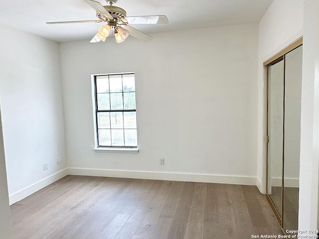 interior space with ceiling fan and light hardwood / wood-style flooring