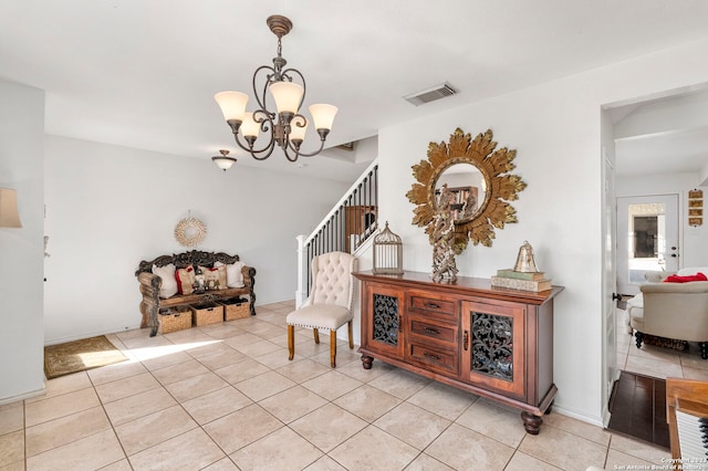 living area featuring a notable chandelier and light tile floors