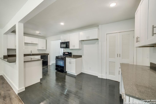 kitchen featuring white cabinetry, dark hardwood / wood-style flooring, sink, and black appliances