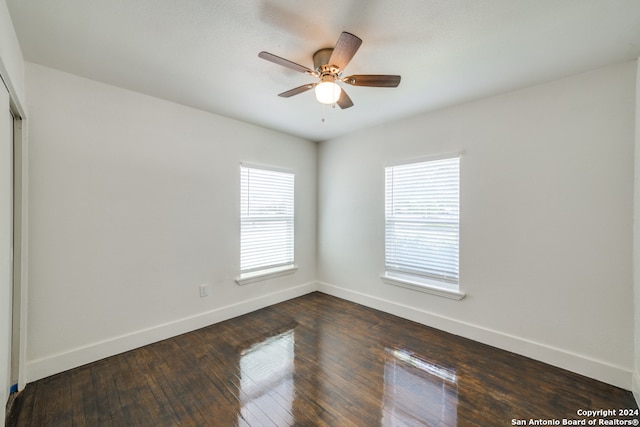 empty room with wood-type flooring and ceiling fan