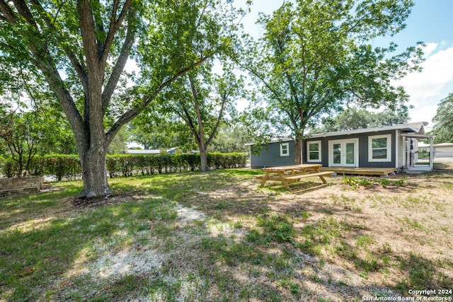 view of yard featuring a wooden deck