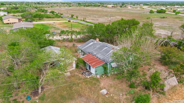 birds eye view of property featuring a rural view