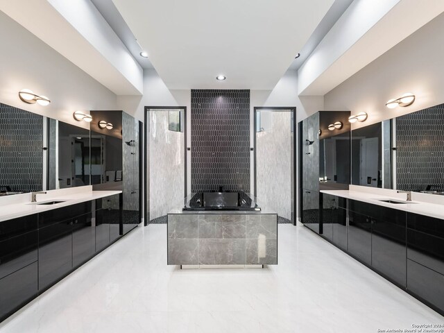 bathroom with tile patterned floors, vanity, and separate shower and tub