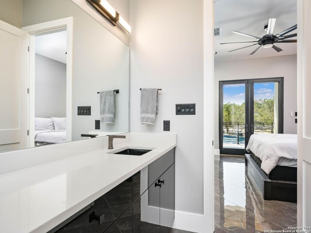 bathroom featuring tile patterned floors, sink, and ceiling fan