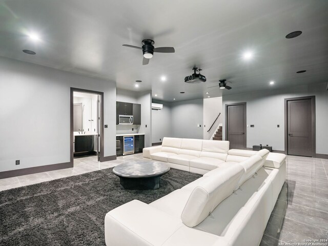 cinema room with beverage cooler, a wall mounted AC, light tile patterned floors, and ceiling fan