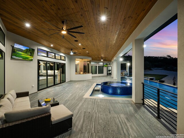 exterior space with ceiling fan and outdoor lounge area