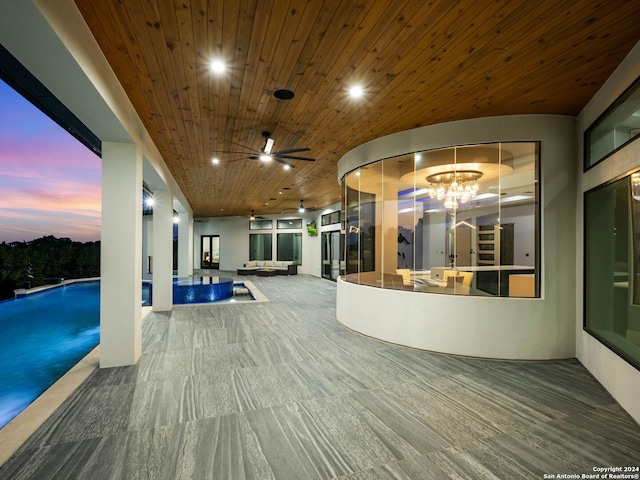 welcome area featuring ceiling fan with notable chandelier