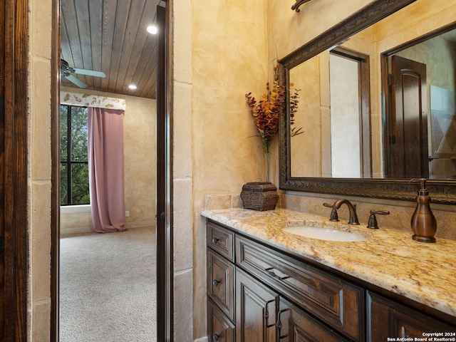 bathroom with wooden ceiling, oversized vanity, ceiling fan, and lofted ceiling