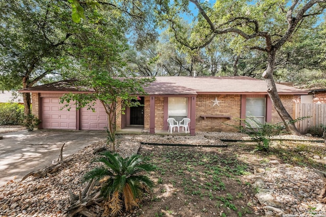 ranch-style home featuring a garage