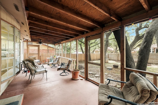 sunroom / solarium featuring ceiling fan