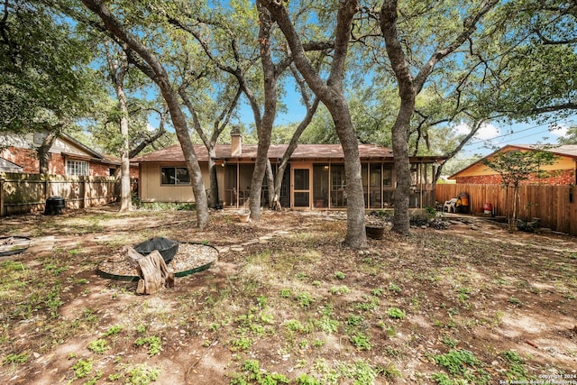 rear view of house with a sunroom