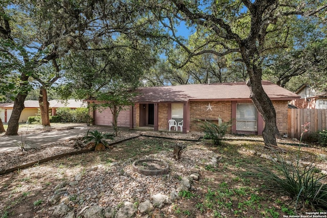 ranch-style house featuring a garage