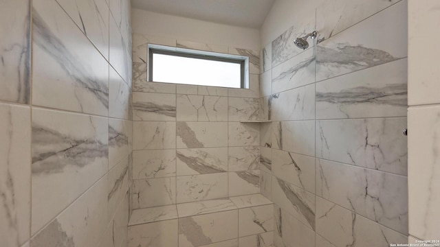 bathroom featuring tiled shower