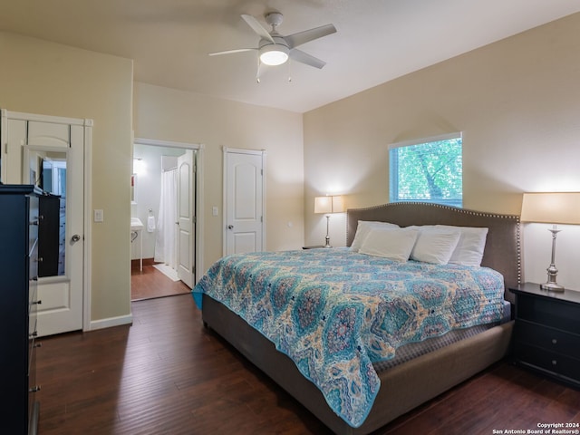 bedroom with connected bathroom, ceiling fan, and dark hardwood / wood-style floors