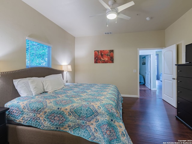 bedroom with ceiling fan and dark hardwood / wood-style flooring