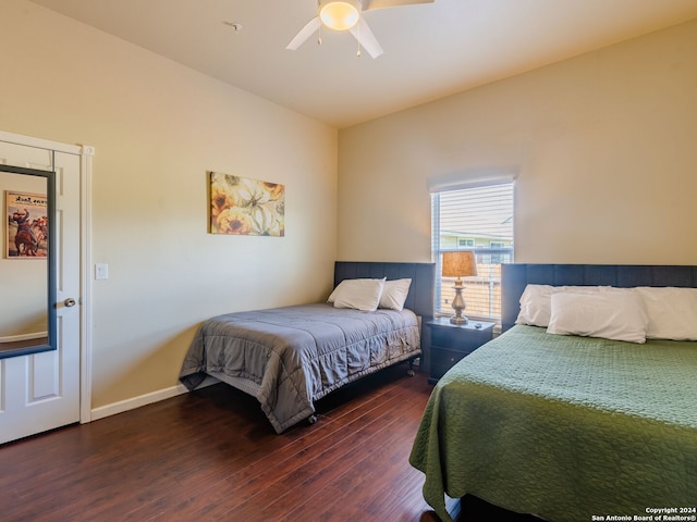 bedroom featuring ceiling fan and dark hardwood / wood-style floors