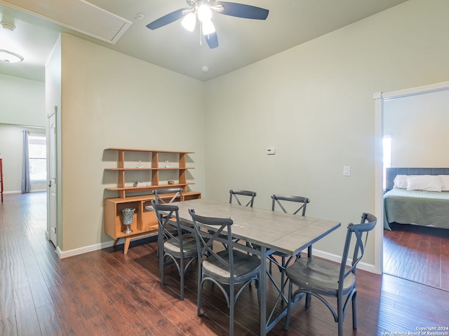 dining room with ceiling fan and dark wood-type flooring