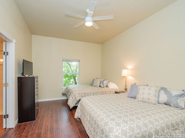 bedroom featuring ceiling fan and dark wood-type flooring